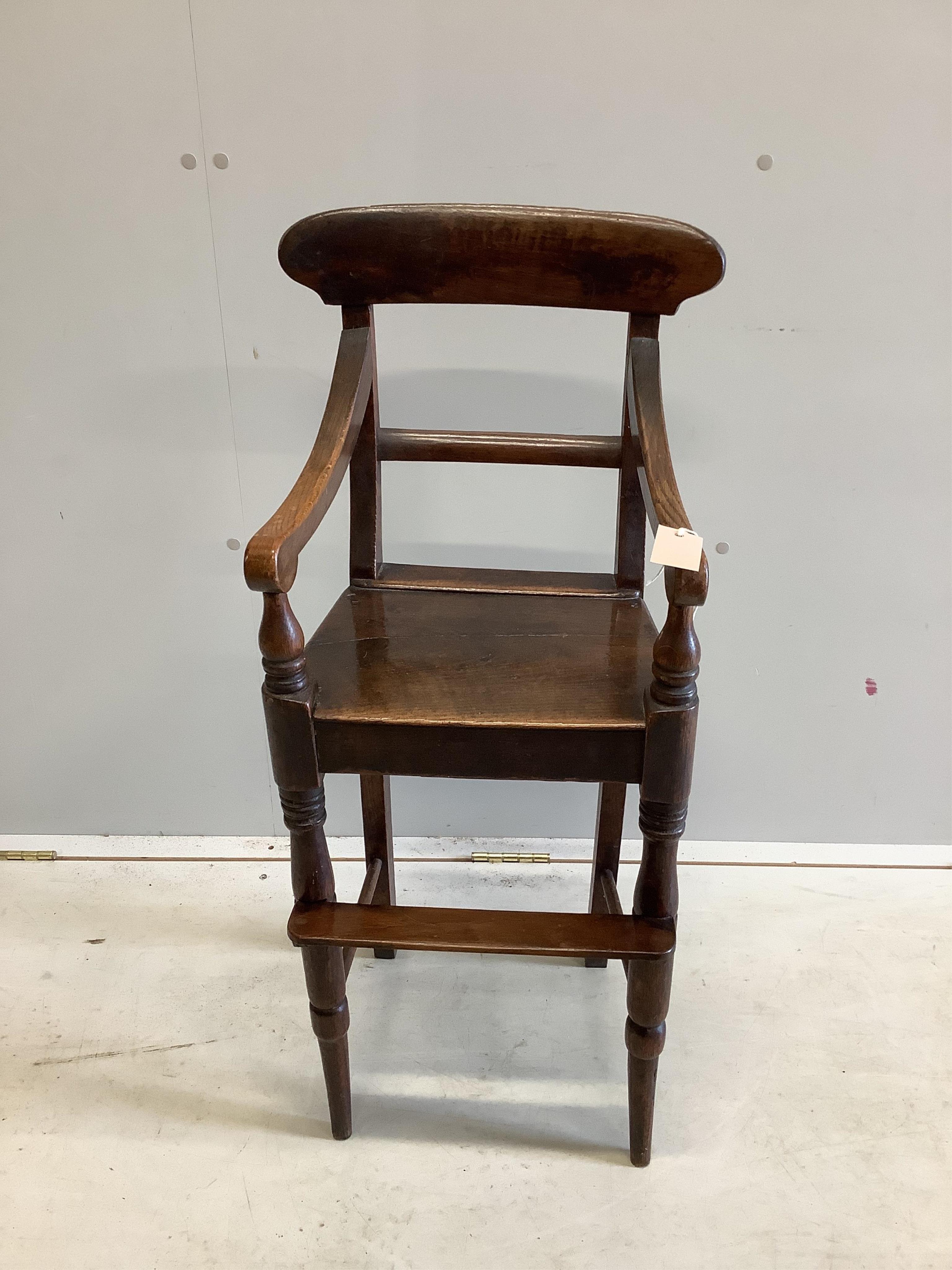 A Regency Provincial oak child's high chair width 34cm, depth 32cm, height 88cm. Condition good